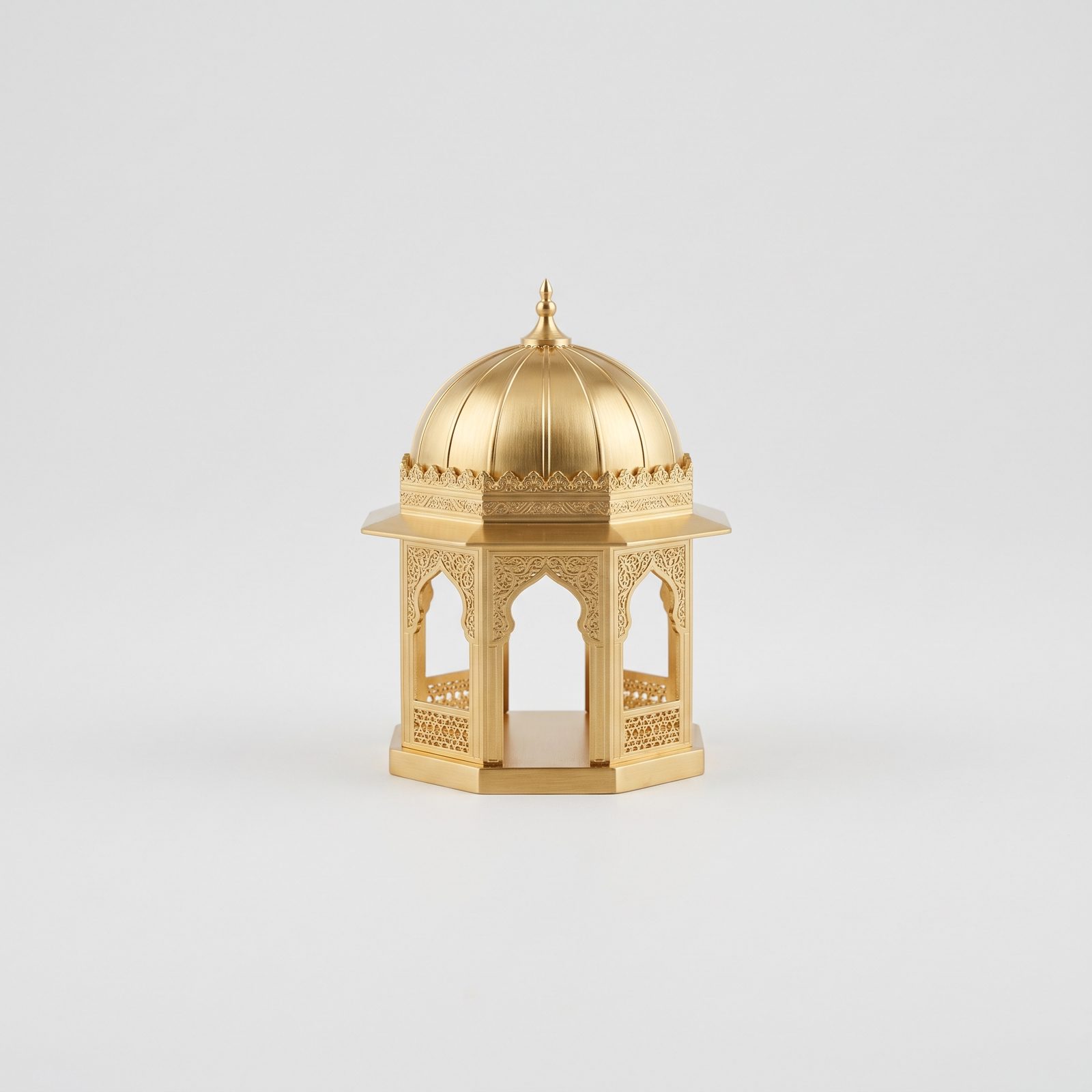 A gilded octagonal brass pavilion with a ribbed dome and pierced Islamic fretwork